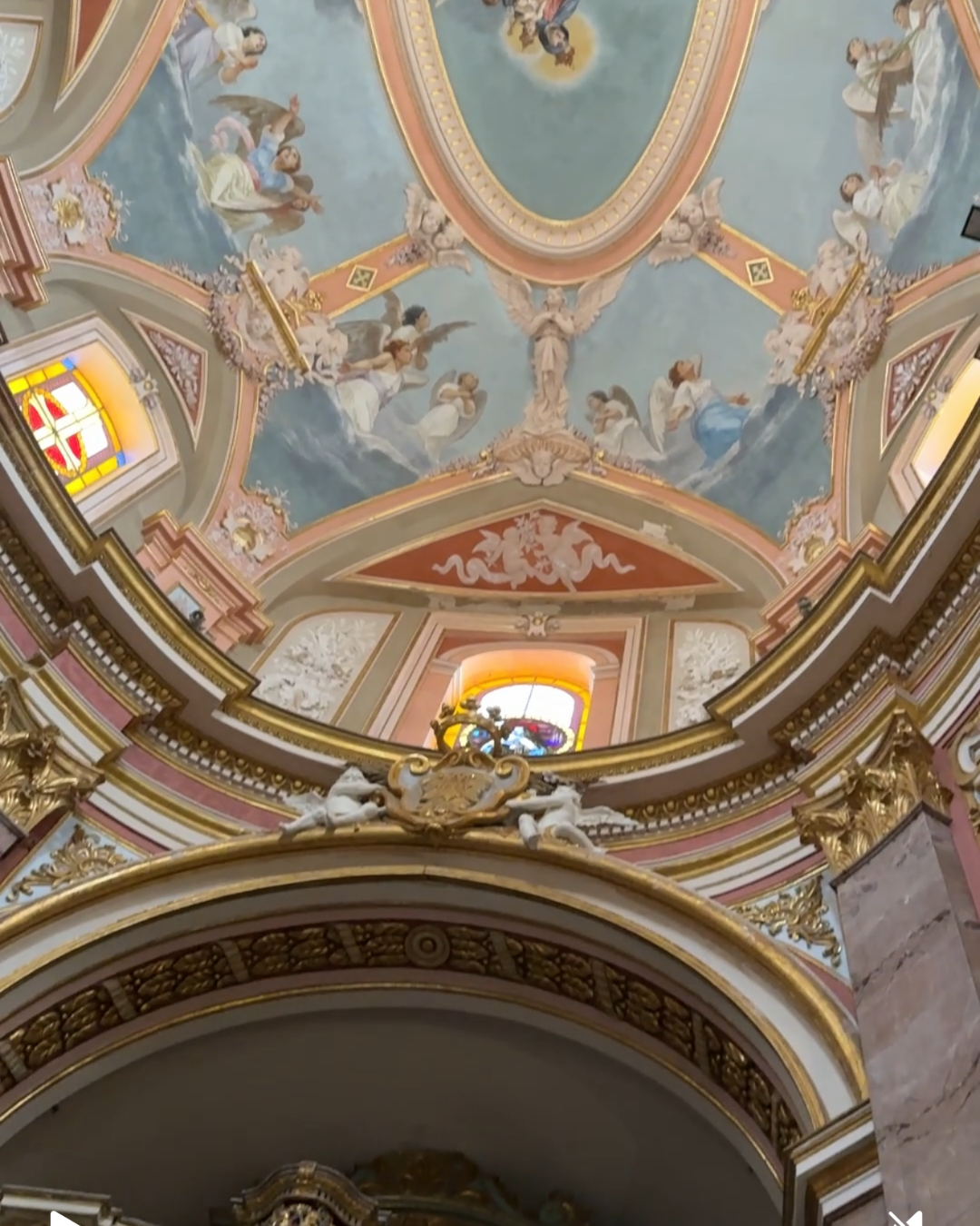 Ceiling fresco with baroque mouldings in traditional Maltese interior design